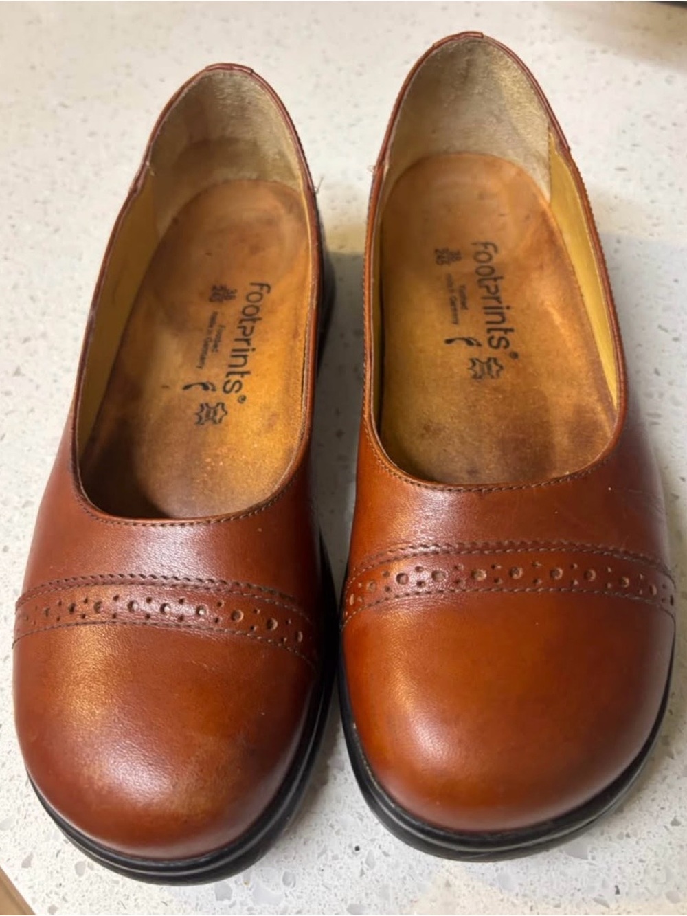 Birkenstock Womenβs Tan Leather Slip-On Flats